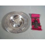 A modern silver hallmarked 'Armada Dish', Sheffield assay (55 grams),