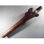 A Fijian hardwood war club with natural root head,