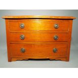 An apprentice piece, serpentine front chest of three drawers,