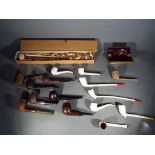 Smoking Interest - A quantity of tobacco pipes including two with silver mounts and a Carlton Ware