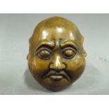 A small brass four-faced Buddha,