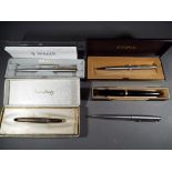 Five Parker pens, predominantly boxed.