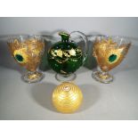 A matched pair of ornamental glass goblets impressed with gold leaf,