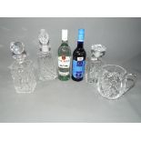 A Thomas Webb glass decanter two further decanters and a water jug,