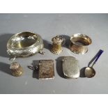A lot to include a silver hallmarked vesta case, napkin ring and enamelled spoon stamped .