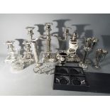 A collection of silver plated items to include candelabra, dwarf candlesticks, goblets,
