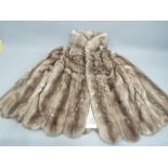 A lady's Rex rabbit fur coat waist length,