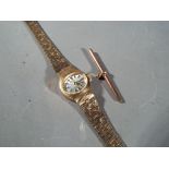 A Lady's 9 carat gold Rotary Swiss made 21 jewel wrist watch with 9 carat gold strap, stamped 375,