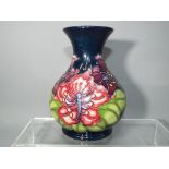 Moorcroft - A Moorcroft Pottery vase of ovoid form with flared rim,