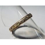 A hallmarked 9ct gold eternity ring, size O and a half, approximately 2.85 grams.