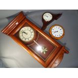Three quartz clocks comprising two wall clocks and a mantel clock.