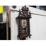 A Vienna styled wall clock, the stained beech case having glazed,