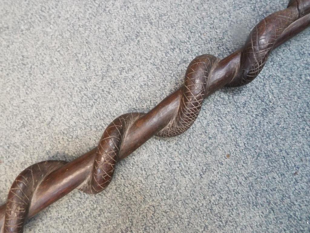 An African hardwood carved tribal staff or totem depicting a snake eating a lizard along the length, - Image 5 of 5