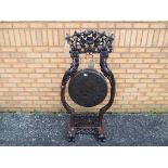 An intricately carved, floor standing Victorian dinner gong,
