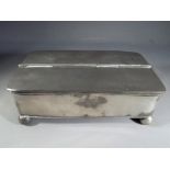 A pewter desk tidy with hinged,