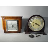 A bakelite cased Enfield mantel clock with key and pendulum and an Art Deco Smiths barometer.