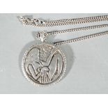 A silver necklace chain 56 cm with fob depicting a nude figure