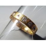 An 18ct yellow gold eternity ring stamped '18ct', size M and a half, approximately 3.65 grams.