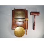 A combination dinner gong and letter rack, wall mountable and a gavel.