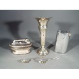 A silver hallmarked trumpet vase, Birmingham assay, date mark unclear,