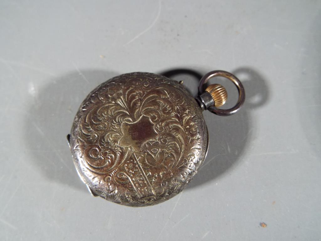 A Lady's silver pocket watch with ceramic dial with Roman numerals gilded highlights, stamped 925, - Image 2 of 3