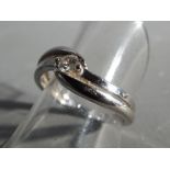 A lady's hallmarked 18 ct white gold diamond solitaire, size N, .15 points, approximate weight 2.