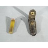 A cheroot holder with 9 carat gold mount,