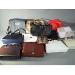 A collection of lady's handbags and purs