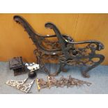 A selection of cast iron items to include two bench ends, an Oriental style lantern, a bell,