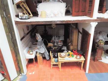 An outstandingly detailed large Tudor style doll's house in naturalistic garden setting, - Image 4 of 6