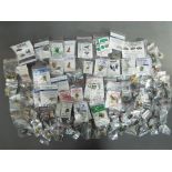 A large quantity of enamel pin badges and similar, predominantly contained in individual bags,