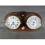 A Sewills Liverpool brass cased ships bulkhead clock and barometer, on wooden mount, approx 16.