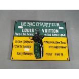 Louis Vuitton cast iron sign measuring approximately 28 cm x 20 cm