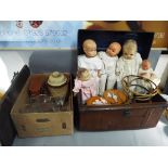 A mixed lot to include a metal trunk, bevel edged wall mirror, vintage dolls, glassware,
