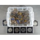A quantity of UK and foreign coins, commemorative crowns and similar.