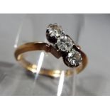 18 ct - an 18 carat gold trilogy ring size O 1/2, approximate weight 2.79 g.