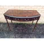 A mahogany three drawer hall table 76 cm x 102 cm x 56 cm.