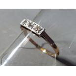 An 18 carat gold trilogy ring with triple diamond set, size Q, approximate weight 1.