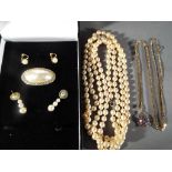 9 ct - a set of single stranded pearl necklace with a pair of matching earrings plus one other set,