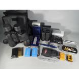 A mixed lot to include binoculars, cigarette lighters, camera equipment, pen and similar.