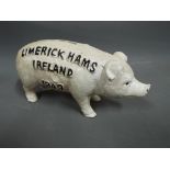 Cast iron money box in the shape of a butcher's pig measuring approximately 9 cm [H] x 18 cm [L].