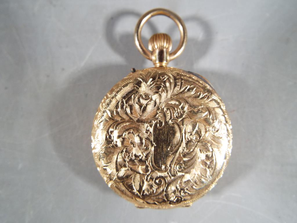 A lady's 14ct gold pocket watch, Roman numerals to the dial, case stamped 14 K, - Image 2 of 3