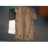 A robe with good quality embroidered floral decoration, a similar scarf and a tablecloth.