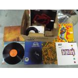 A quantity of 33 and 45 RPM vinyl records to include Eric Clapton, The Who, The Rolling Stones,