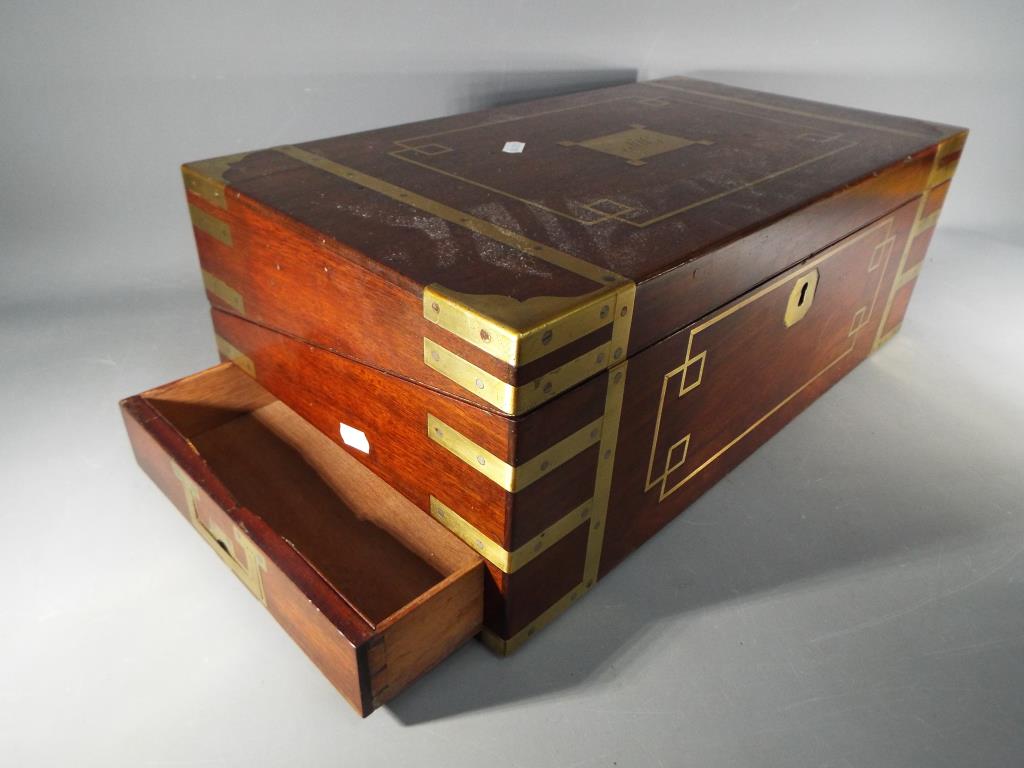 A mahogany and brass bound campaign writing slope with flush brass handles with one end having - Image 3 of 4