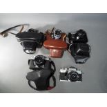 Photography - a collection of vintage 35 mm SLR film cameras to include Praktica Super TL,