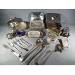 A quantity of plated items to include condiment set, butter dishes, flatware,