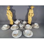 22 pieces of ceramic tableware decorated with an Asian theme displaying Geisha girl in base of cup