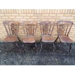 Four oak carved dining chairs.