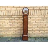 An oak cased granddaughter clock, Arabic numerals, Smiths movement, with key and pendulum,